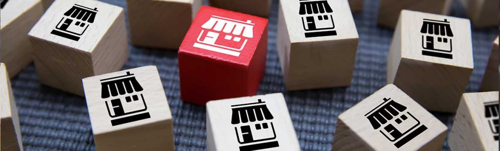 Photo franchise marketing store icon on wooden toy blocks